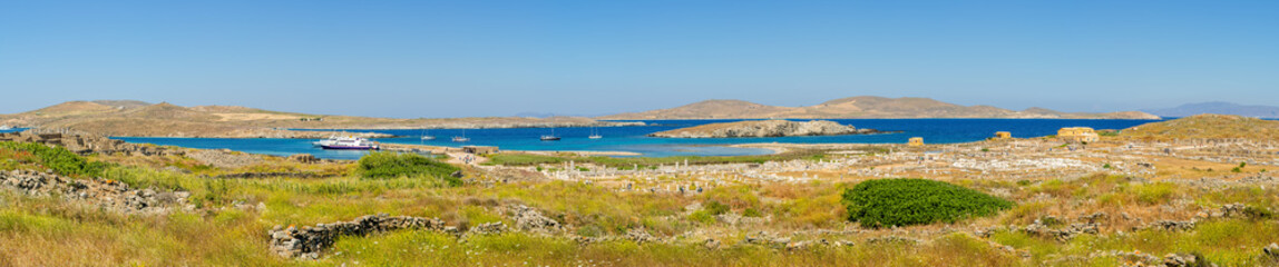 Fototapeta na wymiar Panoramic view of Delos island, the most big archaeological site of Cyclades archipelago. Greece.