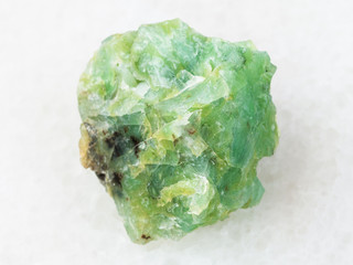 raw crystal of chrysopal gemstone on white