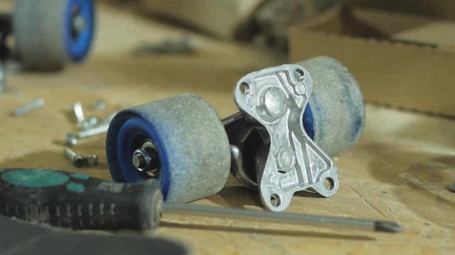 Parts of skateboard on the table, workshop or skatebording store