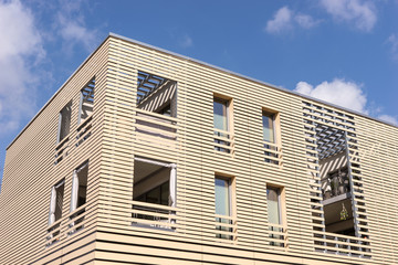 Corner of a modern residential building with wooden paneling