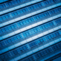 full frame of modern glass building,blue toned.