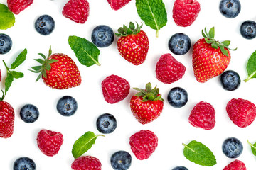 Fototapeta na wymiar Berries Pattern. Fresh berries isolated on white background, top view. Strawberry, Raspberry, Blueberry and Mint leaf, flat lay.