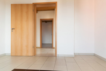 Interior of modern house, nobody inside, There are two doors open.