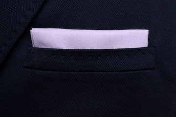 pocket square Purple - handkerchief in the breast pocket of a man's wool luxury dark blue suit