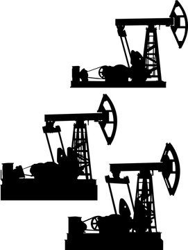 oil derrick three silhouettes isolated on white