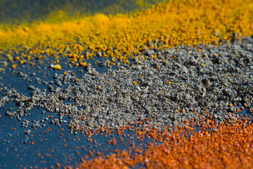 Spice. Background. Red pepper, black pepper and turmeric on a dark background. Macro.