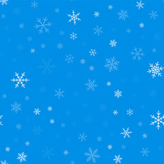 Light blue snowflakes seamless pattern on blue Christmas background. Chaotic scattered light blue snowflakes. Wonderful Christmas creative pattern. Vector illustration.