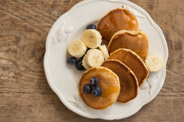 Yummy breakfast. Pancakes with blueberries and banana.