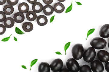 whole and sliced black olives isolated on white background with copy space for your text. Top view. Flat lay pattern