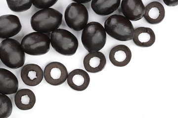 whole and sliced black olives isolated on white background with copy space for your text. Top view. Flat lay pattern