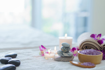 spa ball.spa herbal ball with candle, soap and Stone scrub brush on the white table.