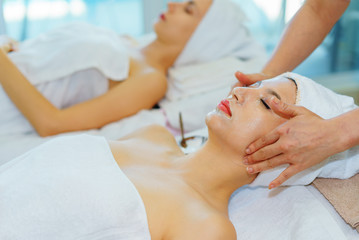 face massage.Face Mask.beautiful woman relax in spa salon.spa wellness set.beauty and fashion set on the white table.