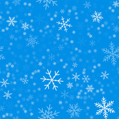 Fototapeta premium Light blue snowflakes seamless pattern on blue Christmas background. Chaotic scattered light blue snowflakes. Excellent Christmas creative pattern. Vector illustration.