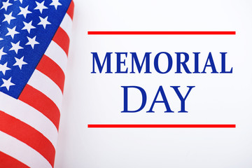 Fototapeta na wymiar Background of United States flag on white background next to text about memorial day celebration.