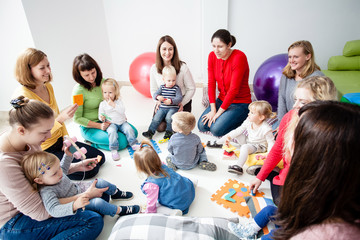 Young moms with their kids