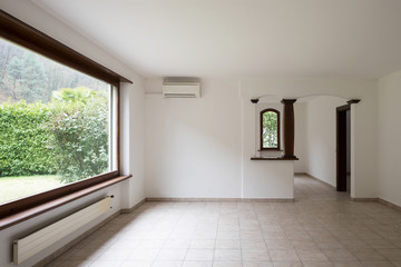 Empty large room with large windows.It's a living room.