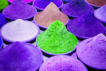 Color coloring dye powder piles in Indian market purple, violet, green