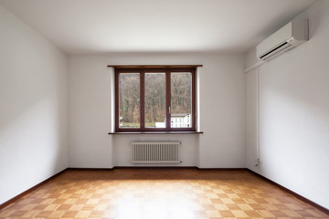 Large empty room with windows