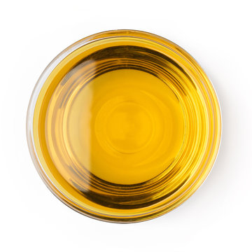 Glass bowl oil of vegetable olive isolated on white background top view object cooking kitchen design