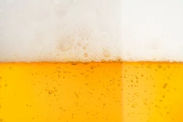 Poster Pouring beer with bubble froth in glass for background on front view  © Love the wind