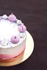 Cake decorated with pink meringues.  Cake for a girl