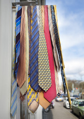 colorful ties hang from rack outside shop in the dutch city of utrecht