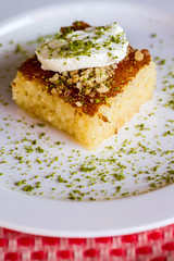 Traditional Turkish Dessert Revani with Cream