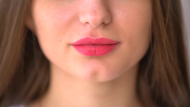 Extreme Close Up of Woman's Sexy Lips with Botox. slow-motion. Close Up of Woman's lips and smile