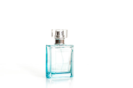 Perfume bottle mockup, blue transparent glass, fragrance spray isolated on white