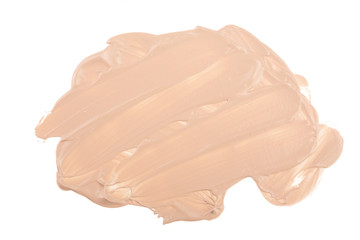 Beige liquid foundation makeup isolated on white background