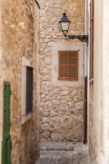 Fototapeta na wymiar Narrow street in village of Valldemossa, Majorca island, Spain.