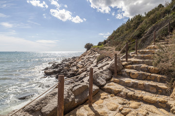 Stone stairs path to mediterranean sea in Costa Dorada, Catalonia, Spain.