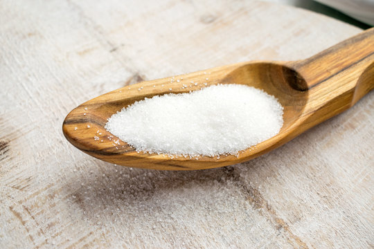 Artificial Sweeteners and Sugar Substitutes in wooden spoon. Natural and synthetic sugarfree food additive:  sorbitol, fructose, honey, Sucralose, Aspartame