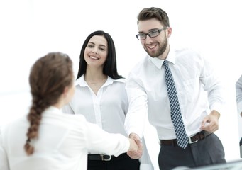 young business woman shaking hands with a colleague