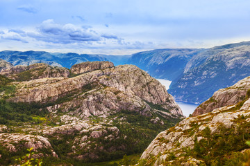 Fototapeta na wymiar Mountains on the way to the Cliff Preikestolen in fjord Lysefjord - Norway