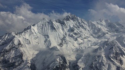 Snow covered mountain Ponggen Dopchu seen from Tserko Ri. Spring scene in the Langtang valley, Nepal.