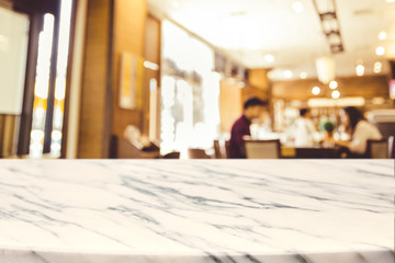 Empty marble Stone table top and blurred restaurant interior background with vintage filter -