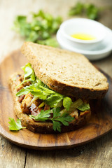 BBQ chicken sandwich on a dark rye bread