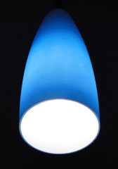 Blue lamp on a black background