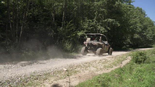 Offroad car driving on a gravel road 