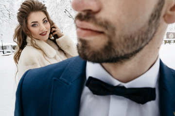 Beautiful wedding couple on their winter wedding