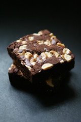 Two brownies close up on blackground 