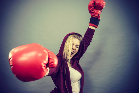 Woman winner wearing boxing gloves