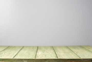 Green table top on a gray background