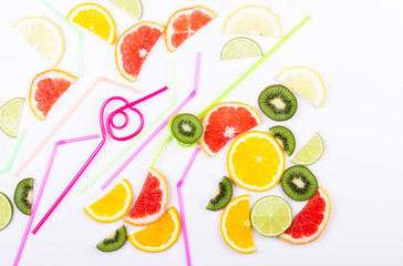 Colorful citrus slices and straws for coctail