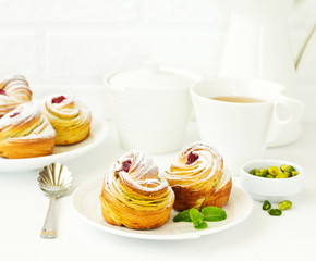 puff pastry with pistachios and raspberries.