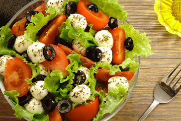 Spring salad with mozzarella, tomatoes and olives in the  LifeStyle