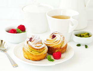 puff pastry with pistachios and raspberries.
