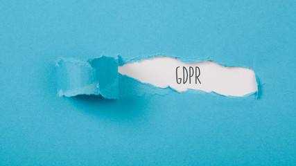 GDPR, general data protection regulation, message on Paper torn ripped opening