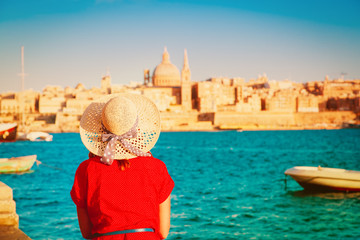 tourist looking at Malta capital in evening